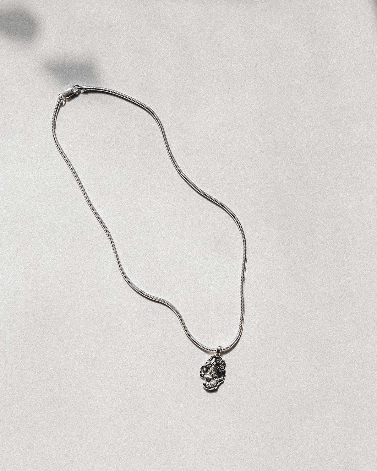soft and sticky sterling silver chain and solid silver pendant