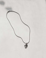soft and sticky sterling silver chain and solid silver pendant
